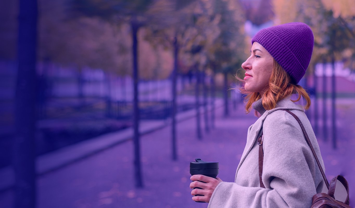 ESG person outdoors with coffee cup highlight